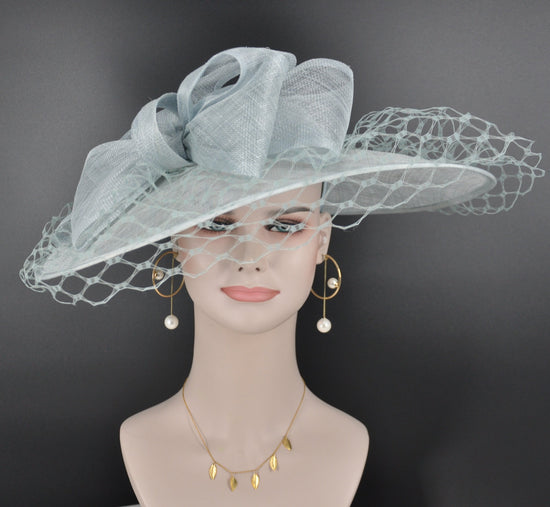 Sinamay Disc Fascinator Hat with  Jumbo Bows and netting Powder Blue