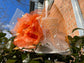 Wide Brim Sinamay Derby Hat: Off White with Orange Silk Flower